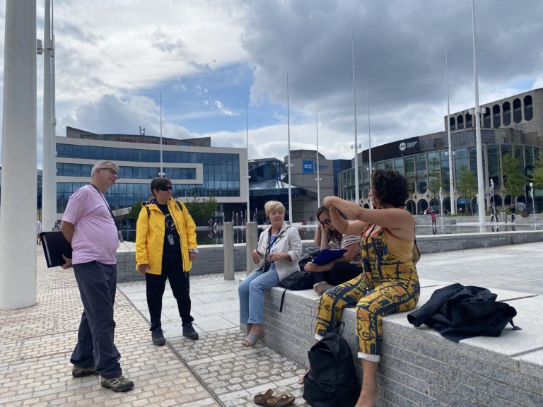 Picture of several Volunteer Guides in Centenary Square during the Training for City in One Square Tour