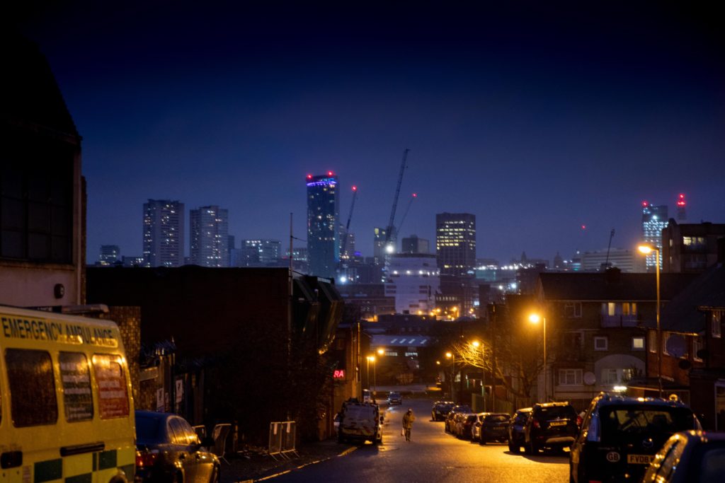 Photograph Birmingham by Night, by Ahsen Sayeed. It depicts the Birmingham skyline at lines with tall building and several construction cranes in the distance.