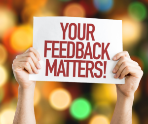 Picture of a sign help up that reads : Your Feedback Matters!