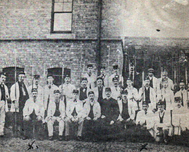 Black and white photograph of the Ladywood’s lamplighters lined up for a photograph at the nearby Cambridge Street Depot, date unknown.