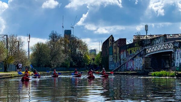 A group of Roundhouse kayakers spread across the canal